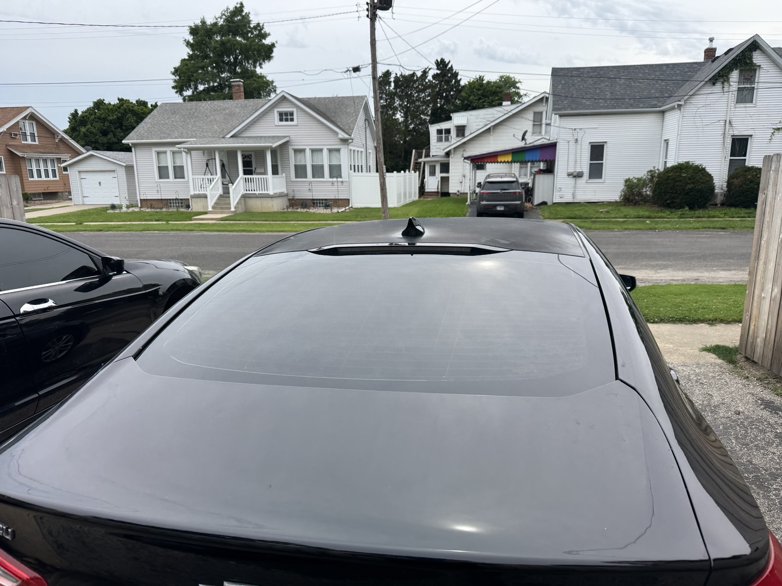 Rear view of black 2018 Chevrolet Malibu with tinted rear window