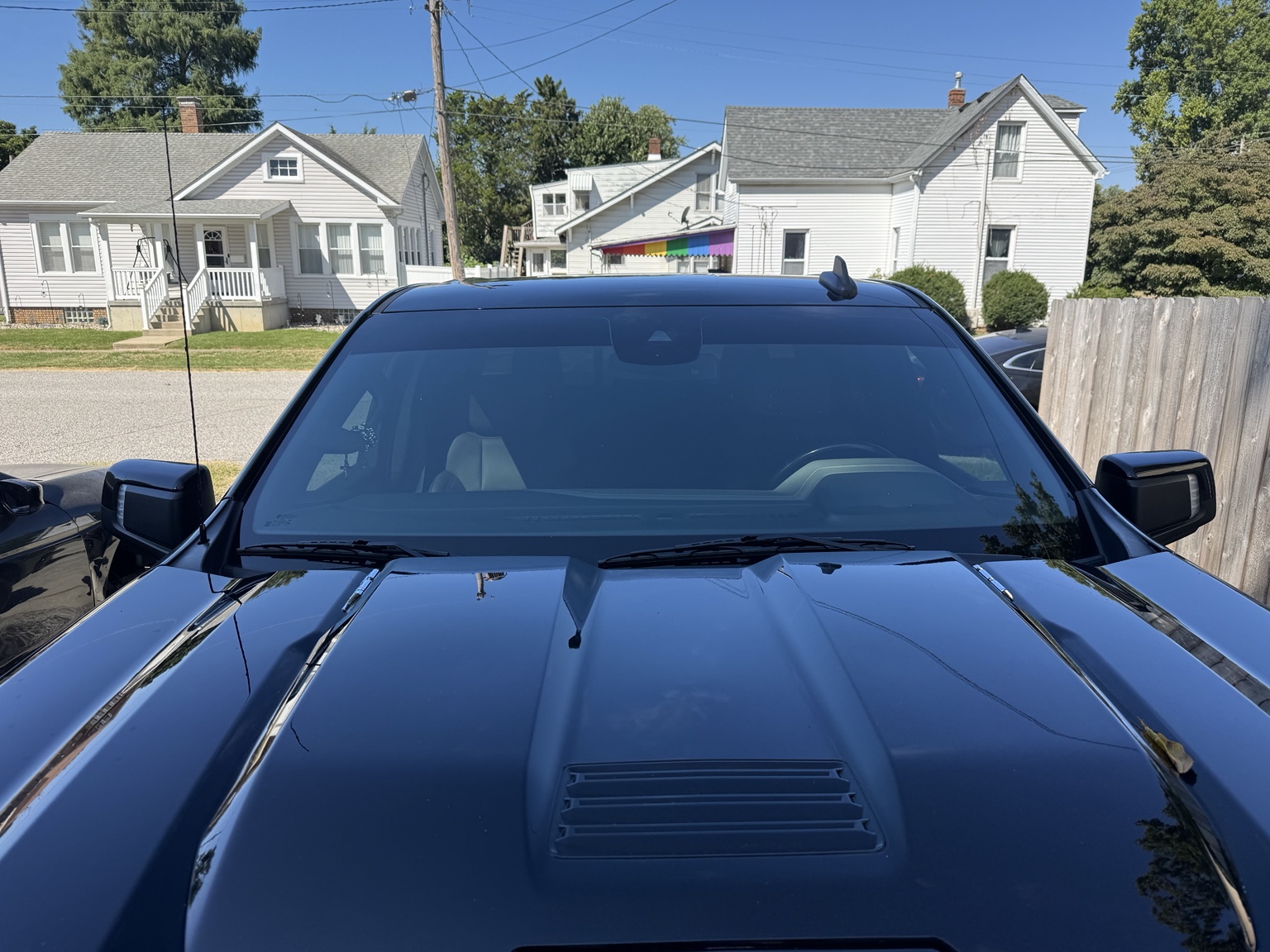 Front view of 2024 Chevrolet Silverado 1500 ZR2 with a dark sunstrip across the top of the windshield